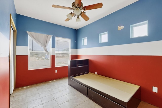 228 18th St SW, Rio Rancho, NM 87124 - bedroom featuring light tile patterned floors and ceiling fan