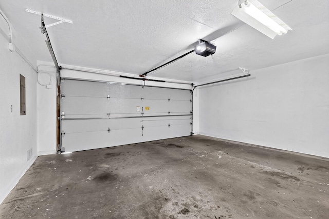 12800 Comanche Rd NE Unit 23, Albuquerque, NM 87111 - garage featuring a garage door opener and electric panel