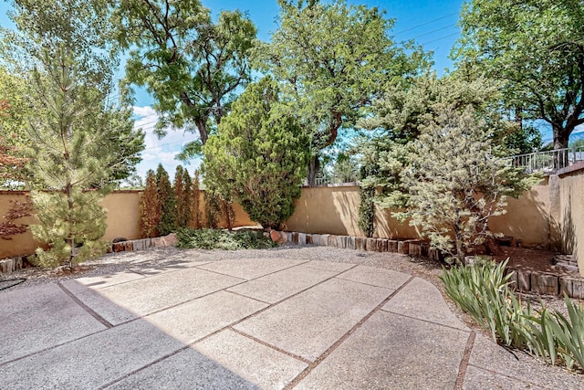 12800 Comanche Rd NE Unit 23, Albuquerque, NM 87111 - fenced backyard featuring a patio
