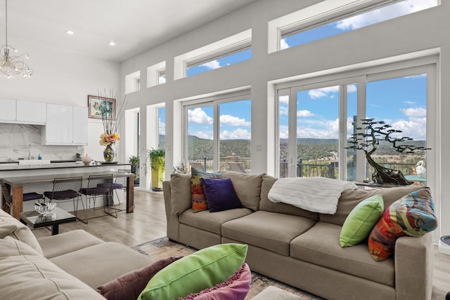 343 Webb Ranch Rd, Pie Town, NM 87827 - living room featuring light wood finished floors, recessed lighting, and a towering ceiling