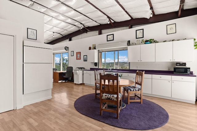 343 Webb Ranch Rd, Pie Town, NM 87827 - dining area with light wood-style floors and a desk
