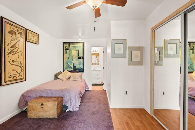 343 Webb Ranch Rd, Pie Town, NM 87827 - bedroom with wood finished floors, ensuite bathroom, and ceiling fan