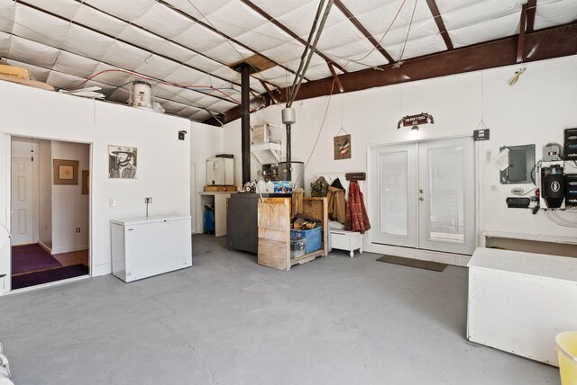 343 Webb Ranch Rd, Pie Town, NM 87827 - garage featuring white refrigerator and french doors
