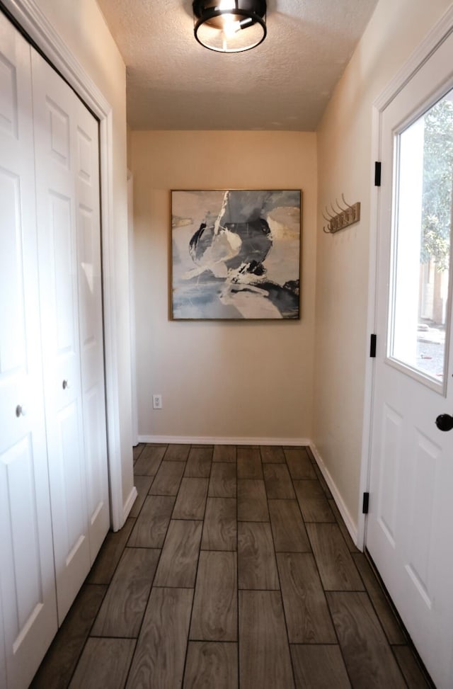 9002 Phoenix Ave NE, Albuquerque, NM 87112 - foyer featuring a textured ceiling and wood finish floors