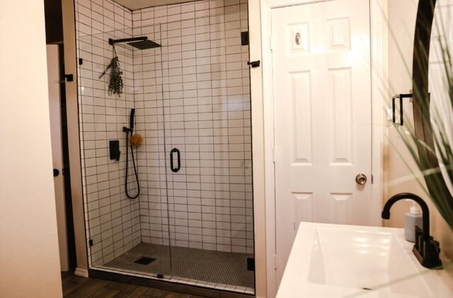 9002 Phoenix Ave NE, Albuquerque, NM 87112 - full bathroom with a stall shower and wood finished floors