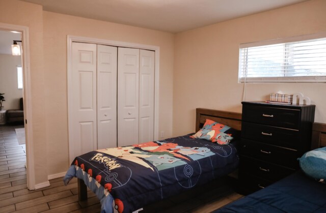 9002 Phoenix Ave NE, Albuquerque, NM 87112 - bedroom featuring a closet and wood finished floors