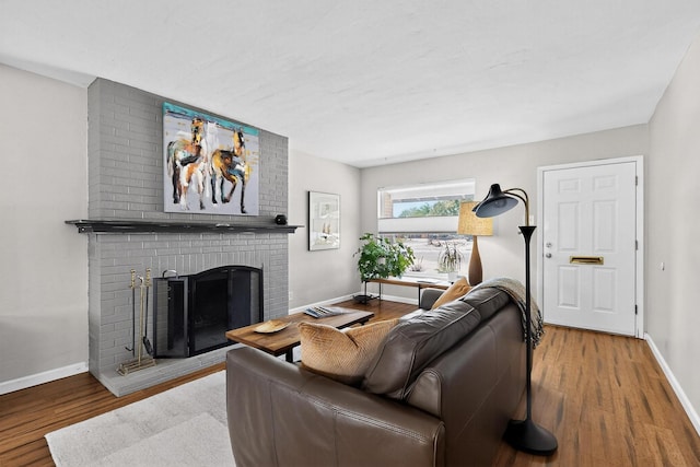 8206 Morrow Ave NE, Albuquerque, NM 87110 - living area with wood finished floors and a brick fireplace