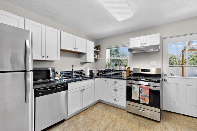 8206 Morrow Ave NE, Albuquerque, NM 87110 - kitchen featuring appliances with stainless steel finishes, under cabinet range hood, open shelves, white cabinetry, and a textured ceiling