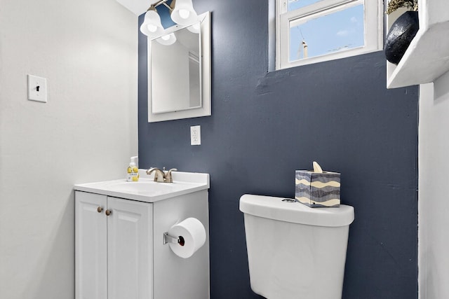8206 Morrow Ave NE, Albuquerque, NM 87110 - half bathroom featuring vanity and toilet