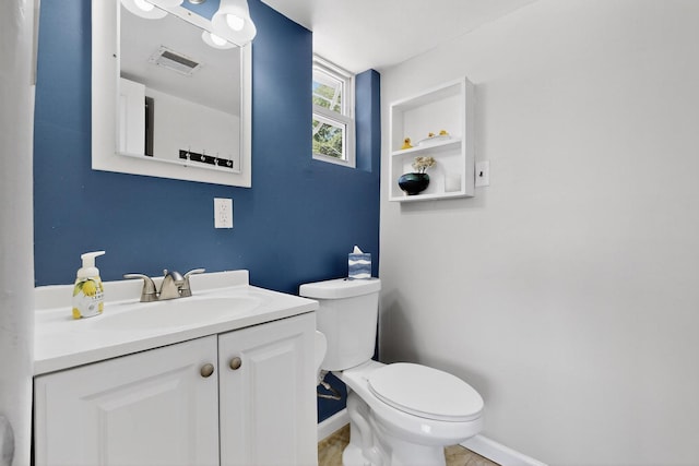 8206 Morrow Ave NE, Albuquerque, NM 87110 - half bathroom featuring vanity and toilet