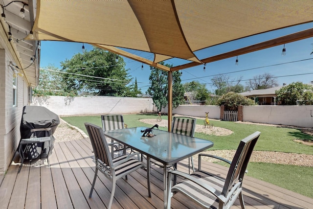 8206 Morrow Ave NE, Albuquerque, NM 87110 - wooden terrace featuring outdoor dining space, a fenced backyard, and grilling area