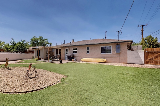 8206 Morrow Ave NE, Albuquerque, NM 87110 - rear view of property featuring a fenced backyard, a patio area, brick siding, and a gate