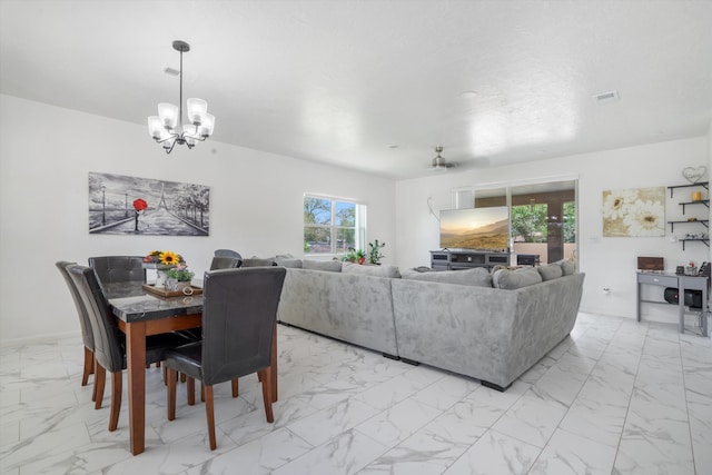 9 Elias Rd, Los Lunas, NM 87031 - dining space with light marble finish floors and a chandelier