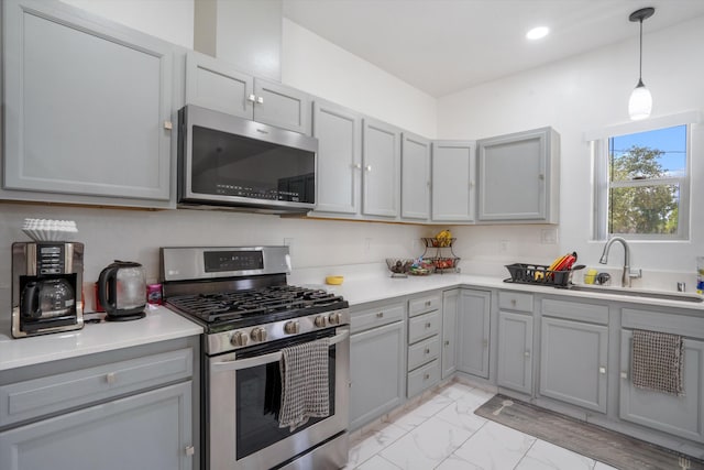 9 Elias Rd, Los Lunas, NM 87031 - kitchen with appliances with stainless steel finishes, gray cabinets, light marble finish floors, light countertops, and recessed lighting