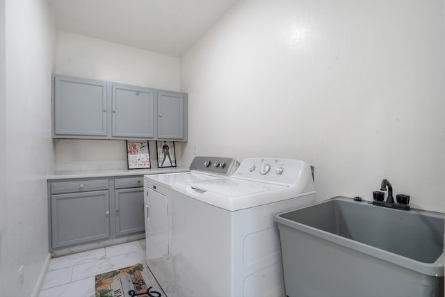 9 Elias Rd, Los Lunas, NM 87031 - washroom featuring cabinet space, light marble finish flooring, and washing machine and dryer