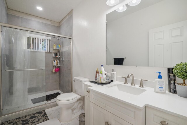 9 Elias Rd, Los Lunas, NM 87031 - bathroom with vanity, a stall shower, and recessed lighting