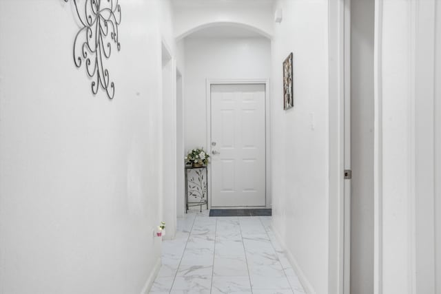 9 Elias Rd, Los Lunas, NM 87031 - corridor with light marble finish floors and arched walkways