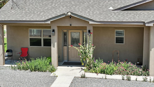 9 Elias Rd, Los Lunas, NM 87031 - entrance to property featuring roof with shingles and stucco siding