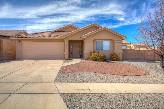 1543 White Pine Dr, Rio Rancho, NM 87144 - mediterranean / spanish home featuring stucco siding, an attached garage, concrete driveway, and a tile roof