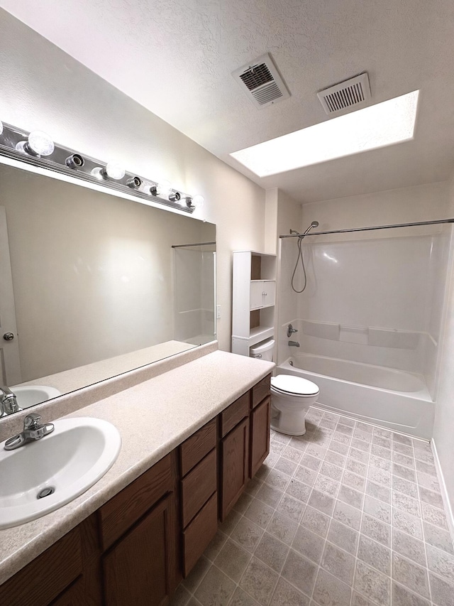 1543 White Pine Dr, Rio Rancho, NM 87144 - bathroom with  shower combination, vanity, a textured ceiling, and a skylight