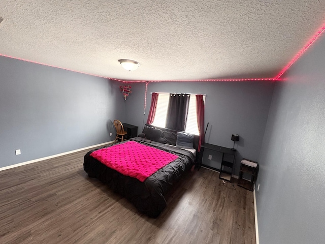 1543 White Pine Dr, Rio Rancho, NM 87144 - bedroom featuring wood finished floors and a textured ceiling