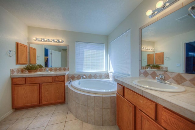 1543 White Pine Dr, Rio Rancho, NM 87144 - full bathroom featuring a bath, two vanities, and tile patterned flooring