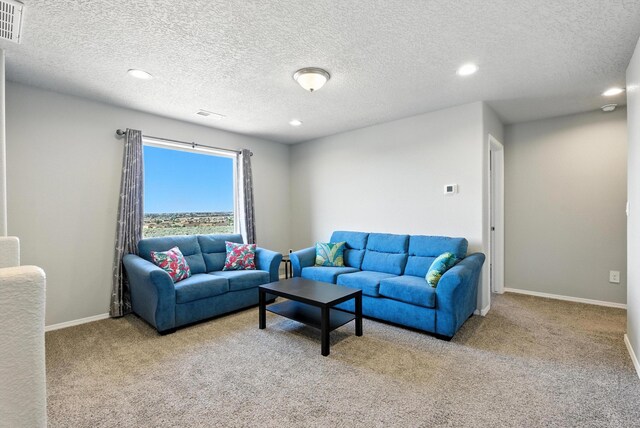 3209 Tazanita Loop SE, Rio Rancho, NM 87124 - carpeted living room with recessed lighting and a textured ceiling
