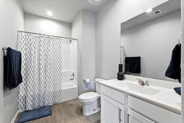3209 Tazanita Loop SE, Rio Rancho, NM 87124 - full bathroom with vanity, wood tiled floors, shower / bathtub combination with curtain, and a textured ceiling