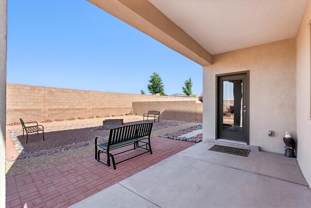 3209 Tazanita Loop SE, Rio Rancho, NM 87124 - fenced backyard with a patio area