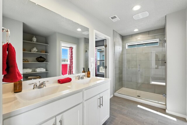 3209 Tazanita Loop SE, Rio Rancho, NM 87124 - full bath featuring a stall shower, double vanity, wood finish floors, and recessed lighting