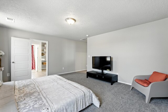 3209 Tazanita Loop SE, Rio Rancho, NM 87124 - carpeted bedroom with a textured ceiling and baseboards