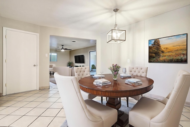 5711 Bohemio Ct SW, Albuquerque, NM 87105 - dining area featuring a chandelier, light tile patterned floors, and a ceiling fan