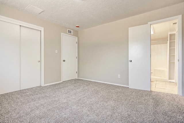 5711 Bohemio Ct SW, Albuquerque, NM 87105 - unfurnished bedroom with carpet, a textured ceiling, and a closet