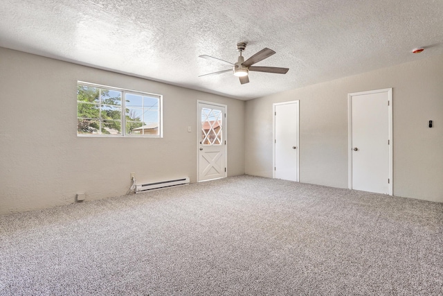 5711 Bohemio Ct SW, Albuquerque, NM 87105 - spare room with a baseboard heating unit, a ceiling fan, healthy amount of natural light, carpet flooring, and a textured ceiling