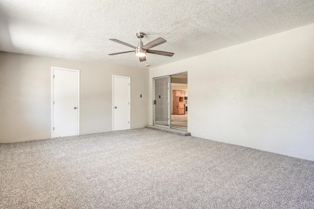5711 Bohemio Ct SW, Albuquerque, NM 87105 - unfurnished bedroom with carpet, ceiling fan, a textured ceiling, and two closets