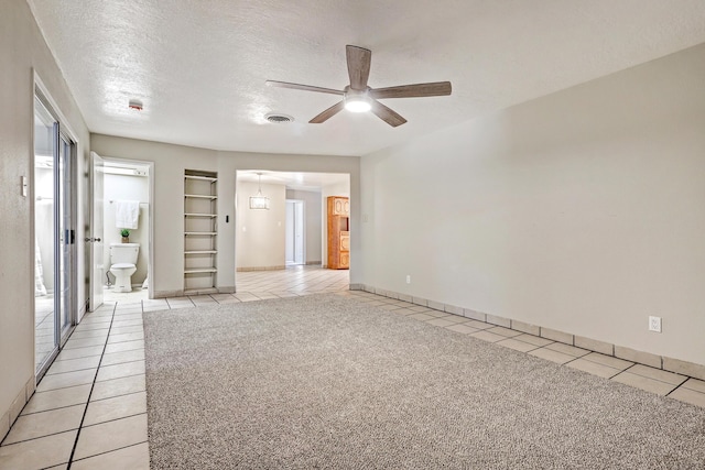 5711 Bohemio Ct SW, Albuquerque, NM 87105 - empty room featuring light tile patterned floors, ceiling fan, and a textured ceiling