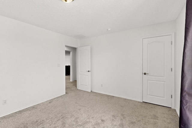 11805 Badger Mountain Trl NW, Albuquerque, NM 87120 - empty room featuring carpet and a textured ceiling