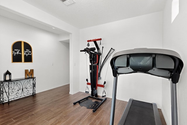 11805 Badger Mountain Trl NW, Albuquerque, NM 87120 - exercise area featuring wood finished floors and baseboards