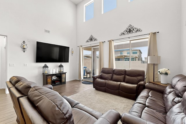 11805 Badger Mountain Trl NW, Albuquerque, NM 87120 - living area with wood finished floors and a towering ceiling