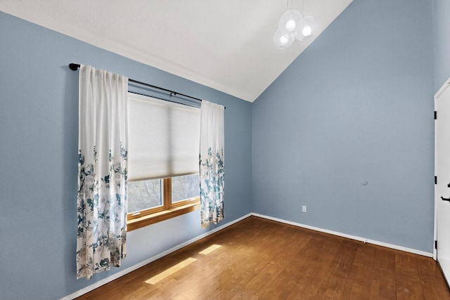 8 Fawn Rd, Cedar Crest, NM 87008 - unfurnished room featuring hardwood / wood-style floors, vaulted ceiling, and a chandelier