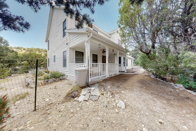 8 Fawn Rd, Cedar Crest, NM 87008 - view of front facade featuring a porch, a ceiling fan, and a chimney