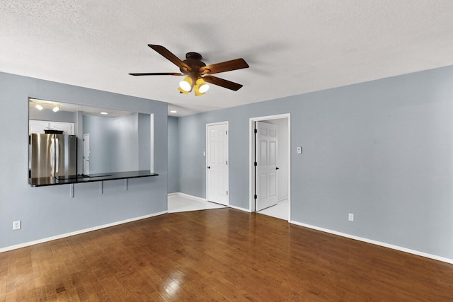 8 Fawn Rd, Cedar Crest, NM 87008 - spare room with a ceiling fan, wood finished floors, and a textured ceiling