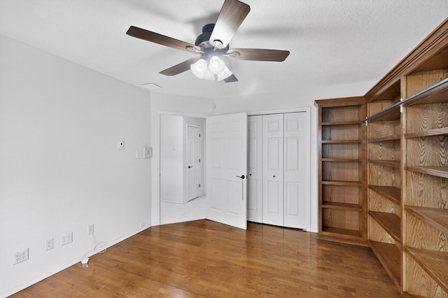 8 Fawn Rd, Cedar Crest, NM 87008 - unfurnished bedroom with wood finished floors and baseboards