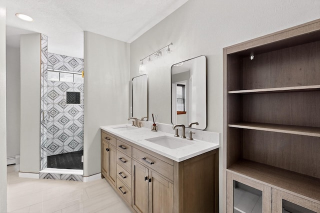 8 Fawn Rd, Cedar Crest, NM 87008 - full bath featuring double vanity, baseboard heating, a stall shower, and tile patterned flooring