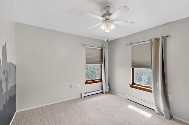 8 Fawn Rd, Cedar Crest, NM 87008 - unfurnished room with a baseboard heating unit, light carpet, and ceiling fan