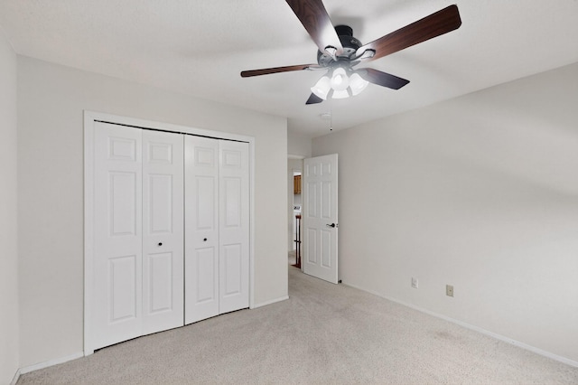 8 Fawn Rd, Cedar Crest, NM 87008 - unfurnished bedroom with light carpet, a closet, and a ceiling fan