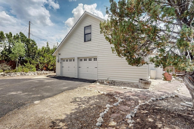8 Fawn Rd, Cedar Crest, NM 87008 - view of side of property with driveway and an attached garage