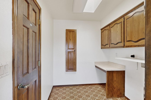 4904 Alberta Ln NW, Albuquerque, NM 87120 - laundry area featuring cabinet space and a skylight