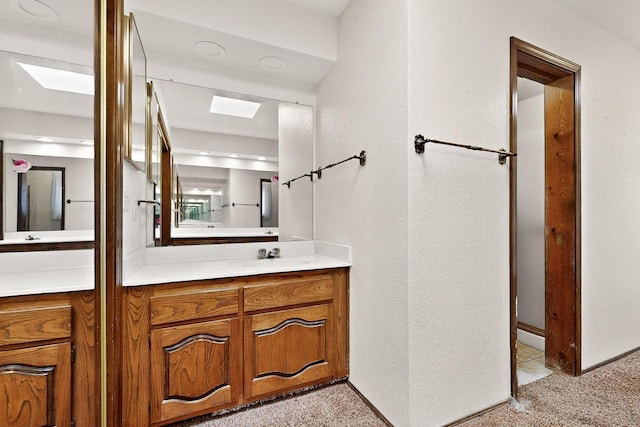 4904 Alberta Ln NW, Albuquerque, NM 87120 - bathroom with vanity and a skylight