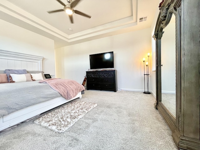 3237 Fennel Rd NE, Rio Rancho, NM 87144 - bedroom featuring carpet flooring, a tray ceiling, and a ceiling fan